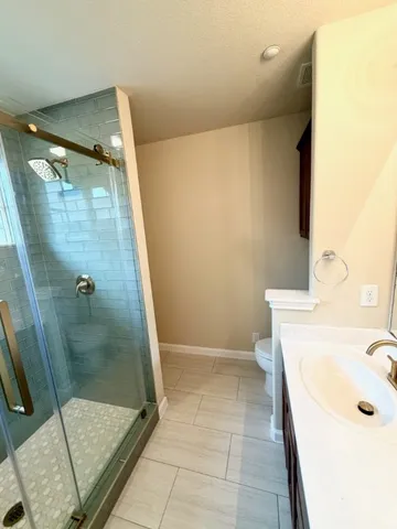 a bathroom with a sink and shower