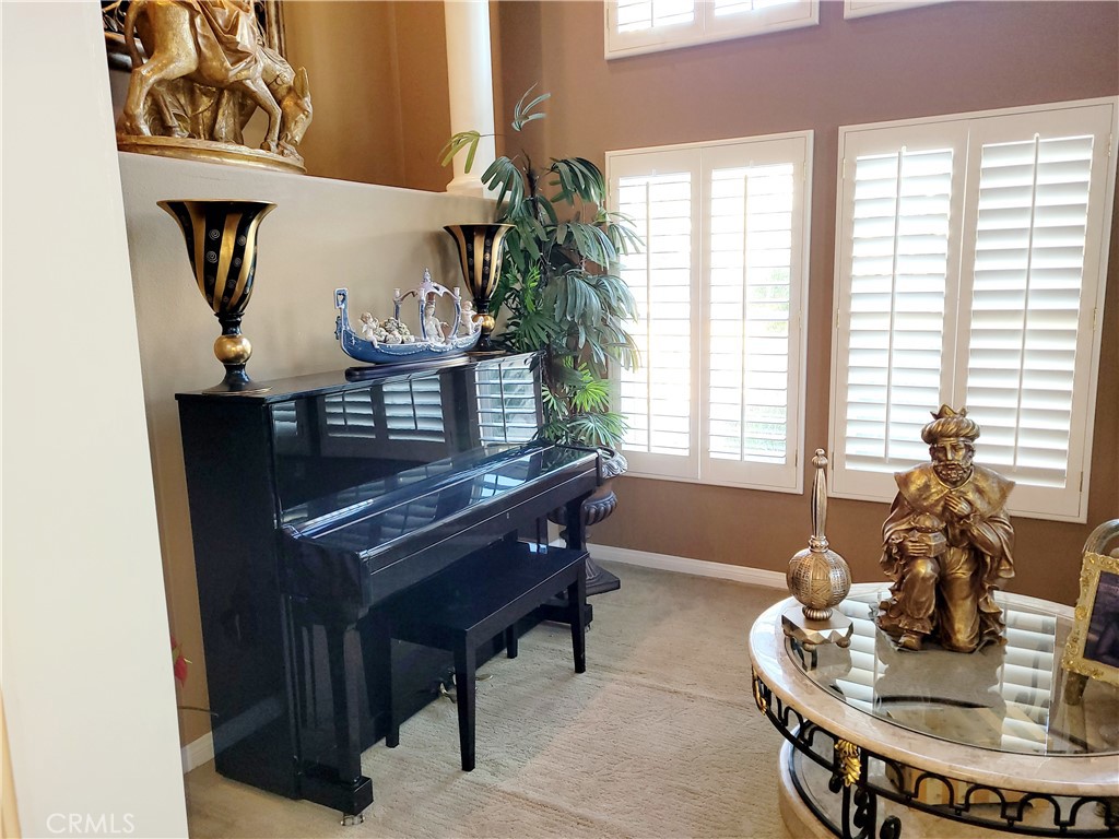 14119 Ashton Lane Riverside, CA 92508 - Photo 32 of 47 a living room with furniture and a potted plant