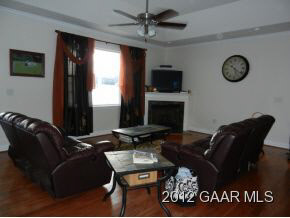 1482 Roman Road Mount Sidney, VA 24467 - Photo 4 of 8 a living room with furniture a flat screen tv and a fireplace