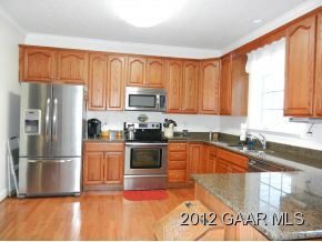1482 Roman Road Mount Sidney, VA 24467 - Photo 5 of 8 a kitchen with granite countertop a refrigerator and a sink