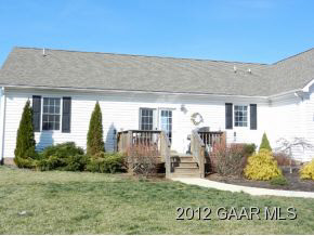 1482 Roman Road Mount Sidney, VA 24467 - Photo 7 of 8 a front view of a house with garden