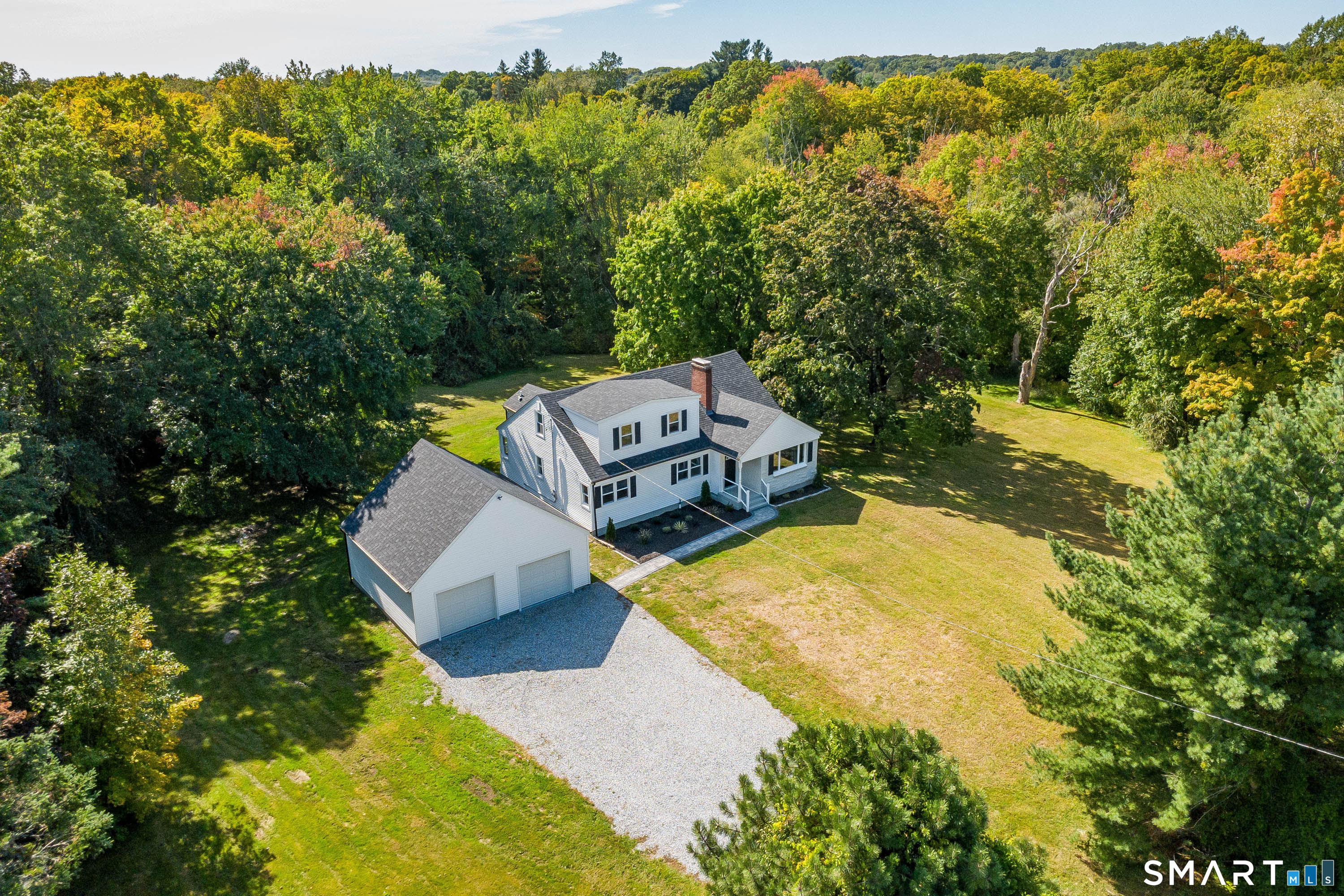 34 Rimmon Road Woodbridge, CT 06525 - Photo 37 of 40 Aerial view showcasing the home, detached two-car garage and spacious property.