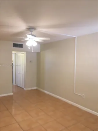 an empty room with a bathroom