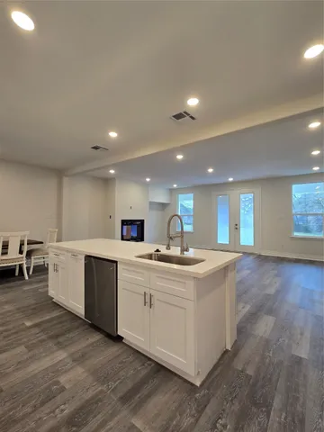 a view of kitchen with sink microwave and stove