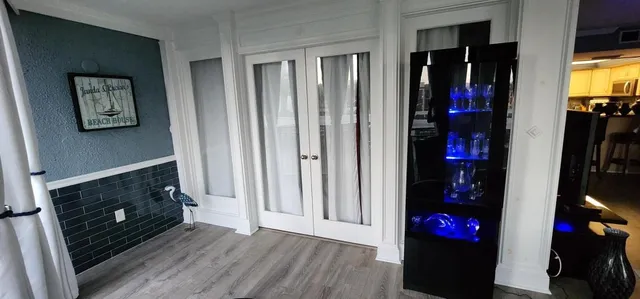 a living room with a fireplace and a flat screen tv