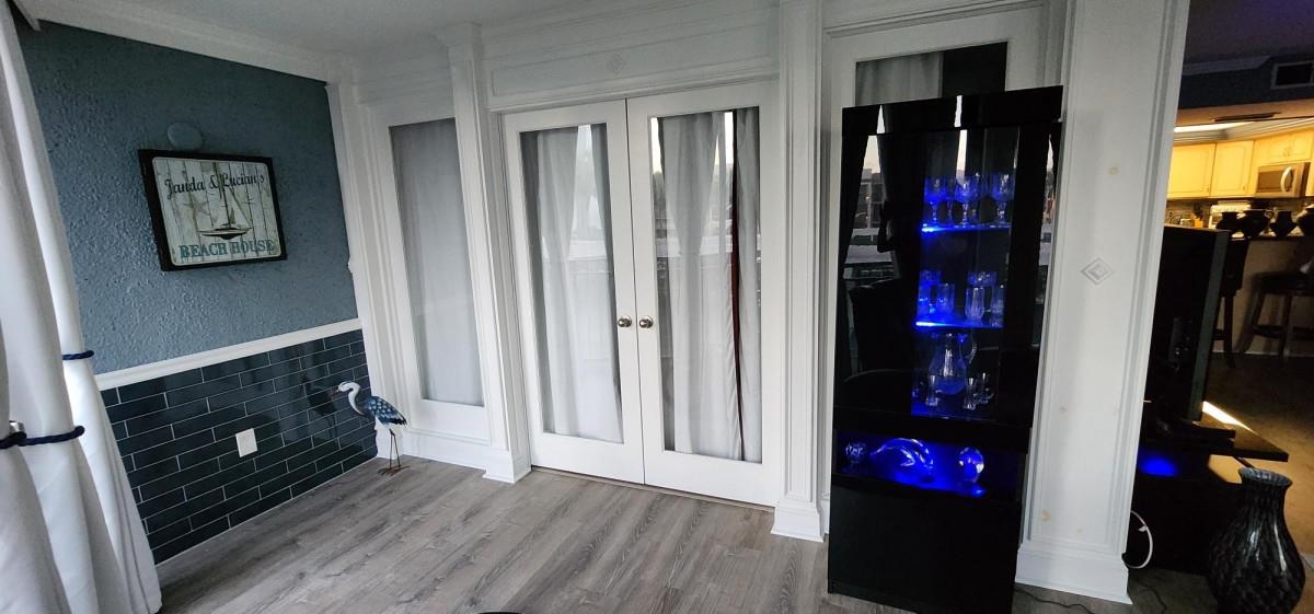 2 Dondanville Road, Unit 216 St. Augustine, FL 32080 - Photo 11 of 23 a living room with a fireplace and a flat screen tv