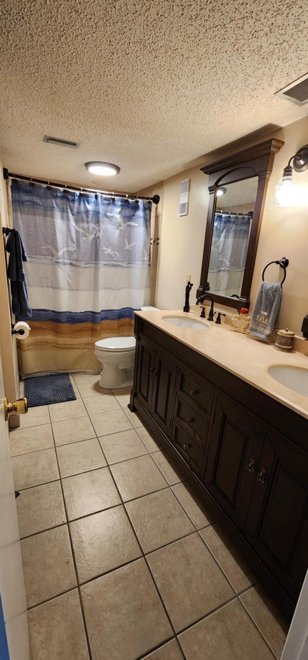 2 Dondanville Road, Unit 216 St. Augustine, FL 32080 - Photo 15 of 23 a bathroom with a sink a mirror and bathtub