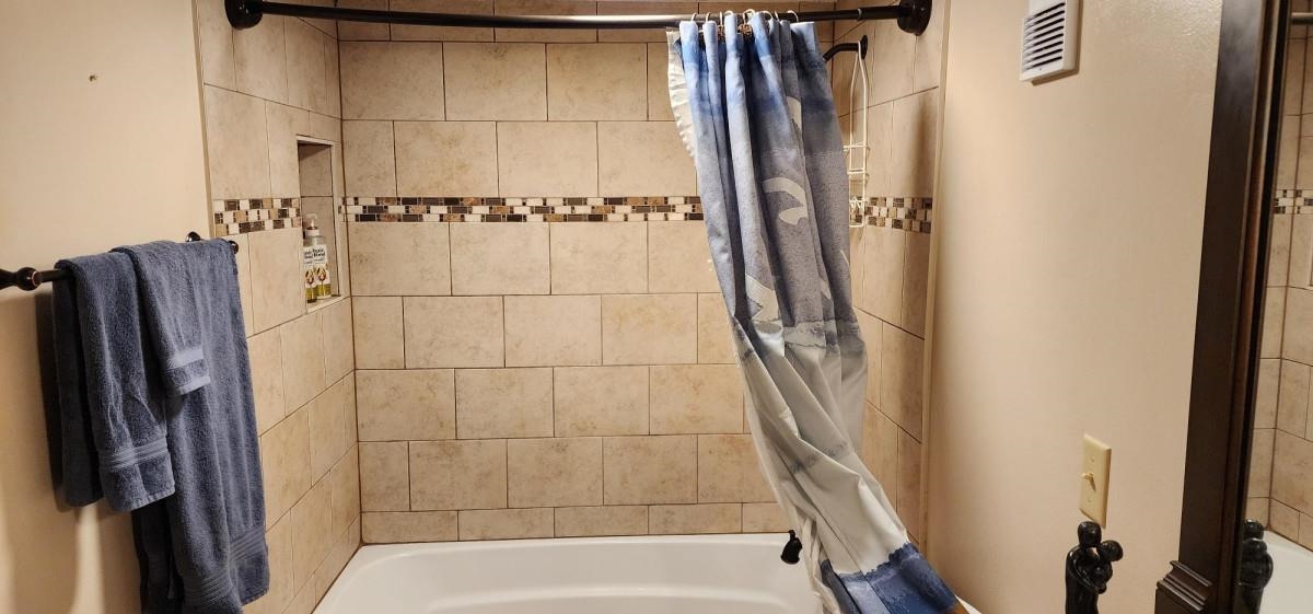 2 Dondanville Road, Unit 216 St. Augustine, FL 32080 - Photo 17 of 23 a bathroom with a shower and a glass door