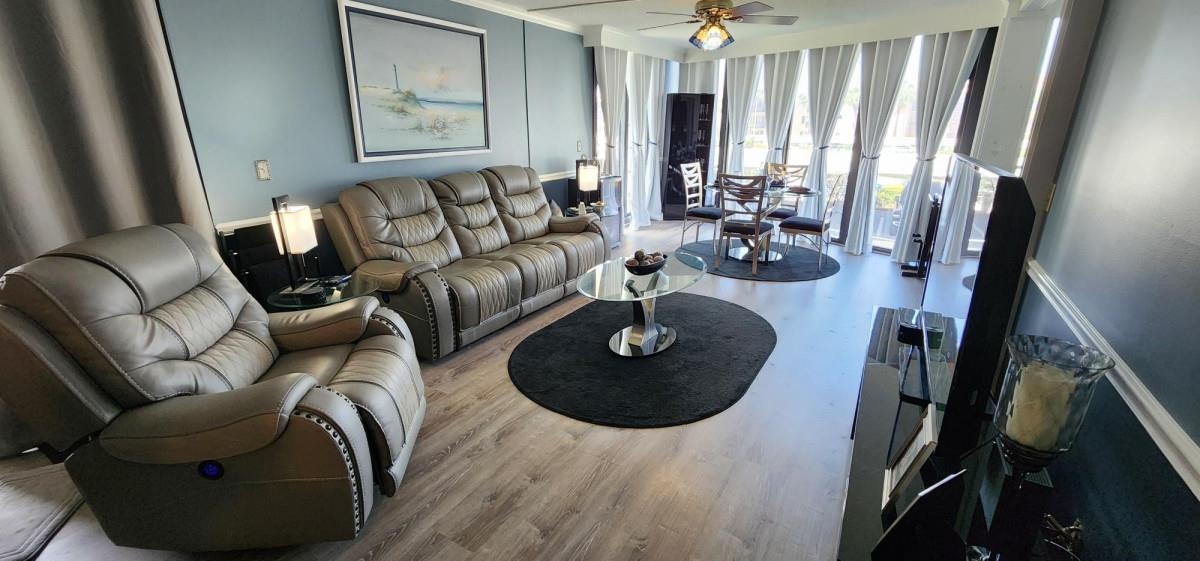 2 Dondanville Road, Unit 216 St. Augustine, FL 32080 - Photo 2 of 23 a living room with furniture and wooden floor