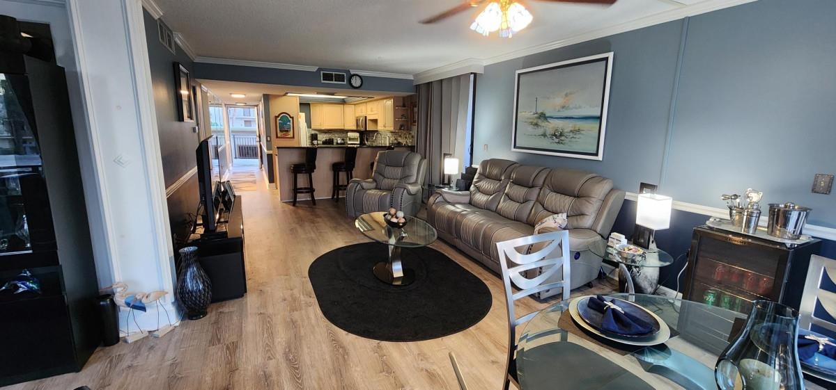 2 Dondanville Road, Unit 216 St. Augustine, FL 32080 - Photo 3 of 23 a living room with furniture and a flat screen tv