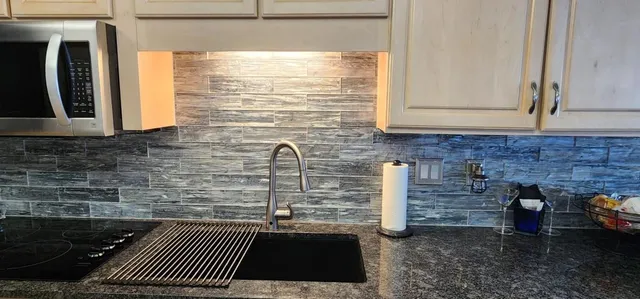 a kitchen with a sink and a window