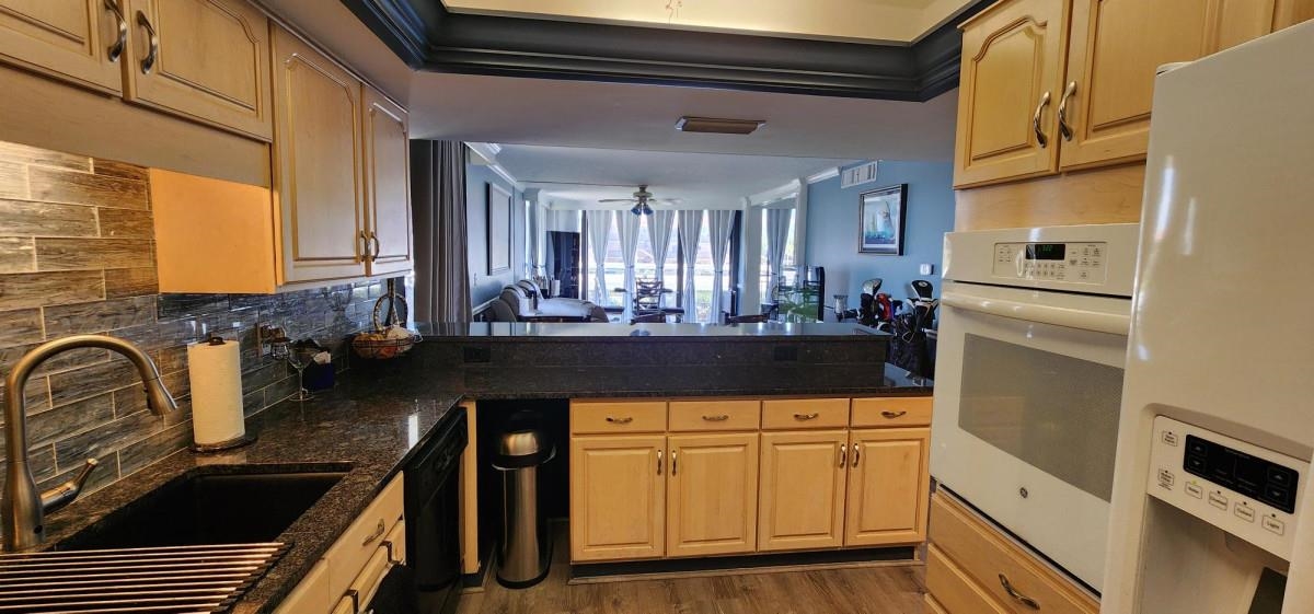 2 Dondanville Road, Unit 216 St. Augustine, FL 32080 - Photo 9 of 23 a kitchen with sink refrigerator and stove