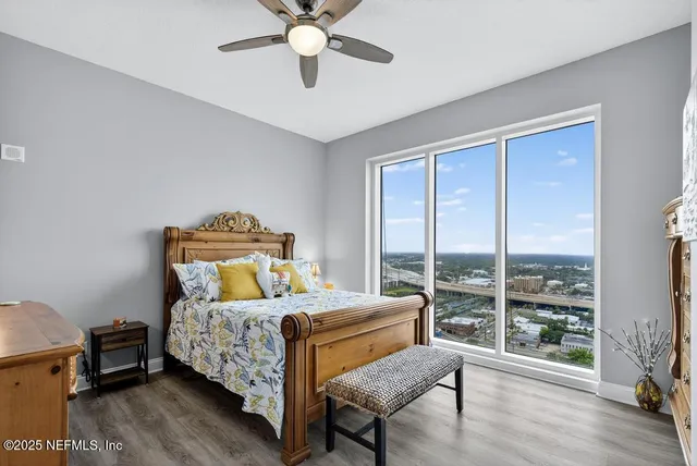 a bathroom with a sink mirror and a toilet
