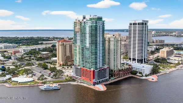 a building outdoor space with patio furniture and city view