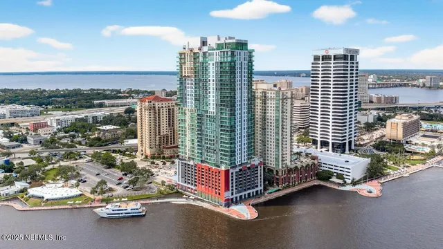a building outdoor space with patio furniture and city view