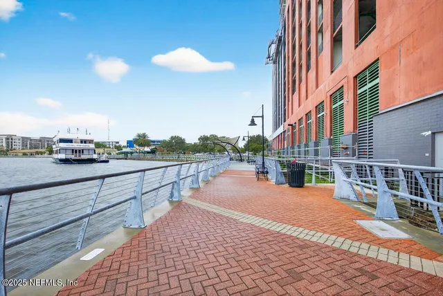 a view of an empty room with windows