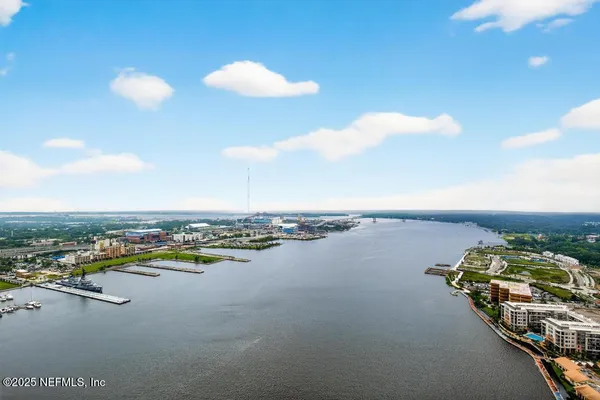 a kitchen with granite countertop a refrigerator stove and sink