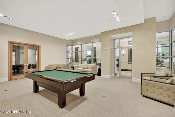 a room with gym equipment and a large window