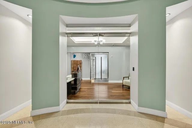 a dining room with furniture window and wooden floor