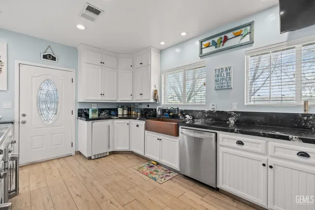 a bathroom with a shower and a sink