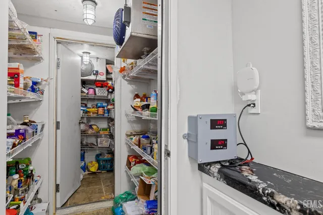 a bathroom with a shower and a sink