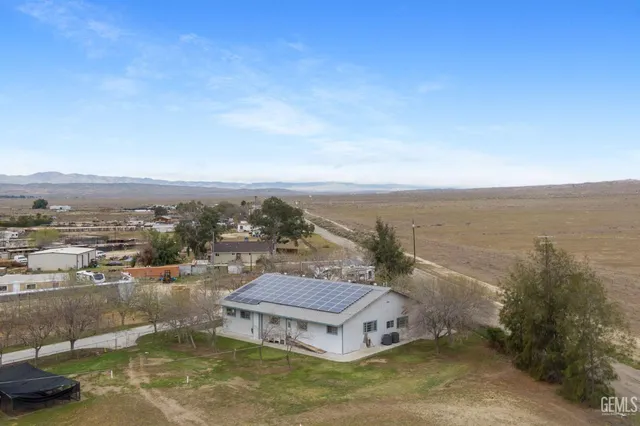 a living room with furniture a rug and a chandelier