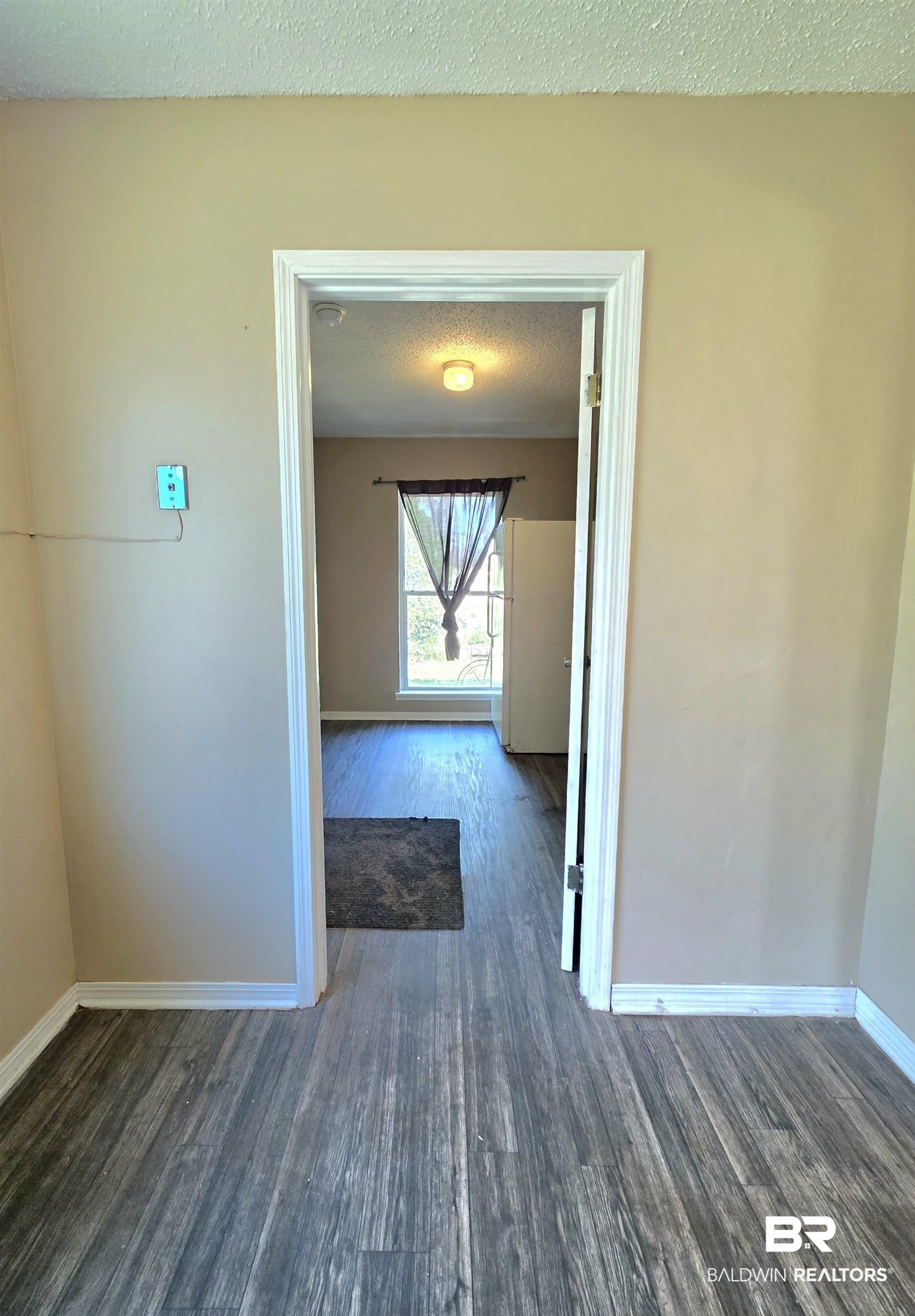 11 Coal Fire Road Jackson, AL 36545 - Photo 17 of 23 Hallway with dark wood-type flooring and a textured ceiling