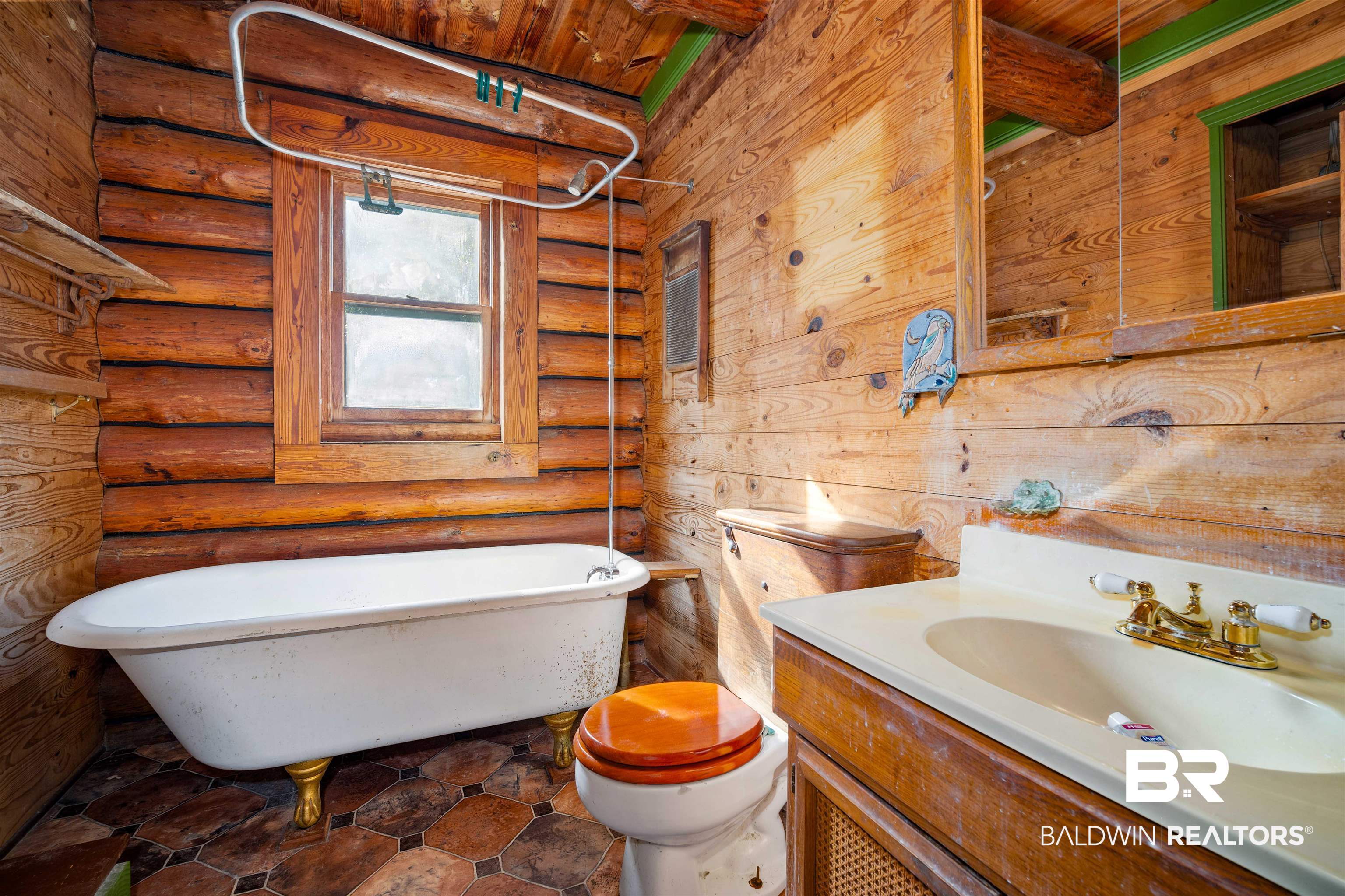 11236 Wren Avenue Fairhope, AL 36532 - Photo 21 of 35 Full bath with a freestanding tub, rustic walls, and vanity
