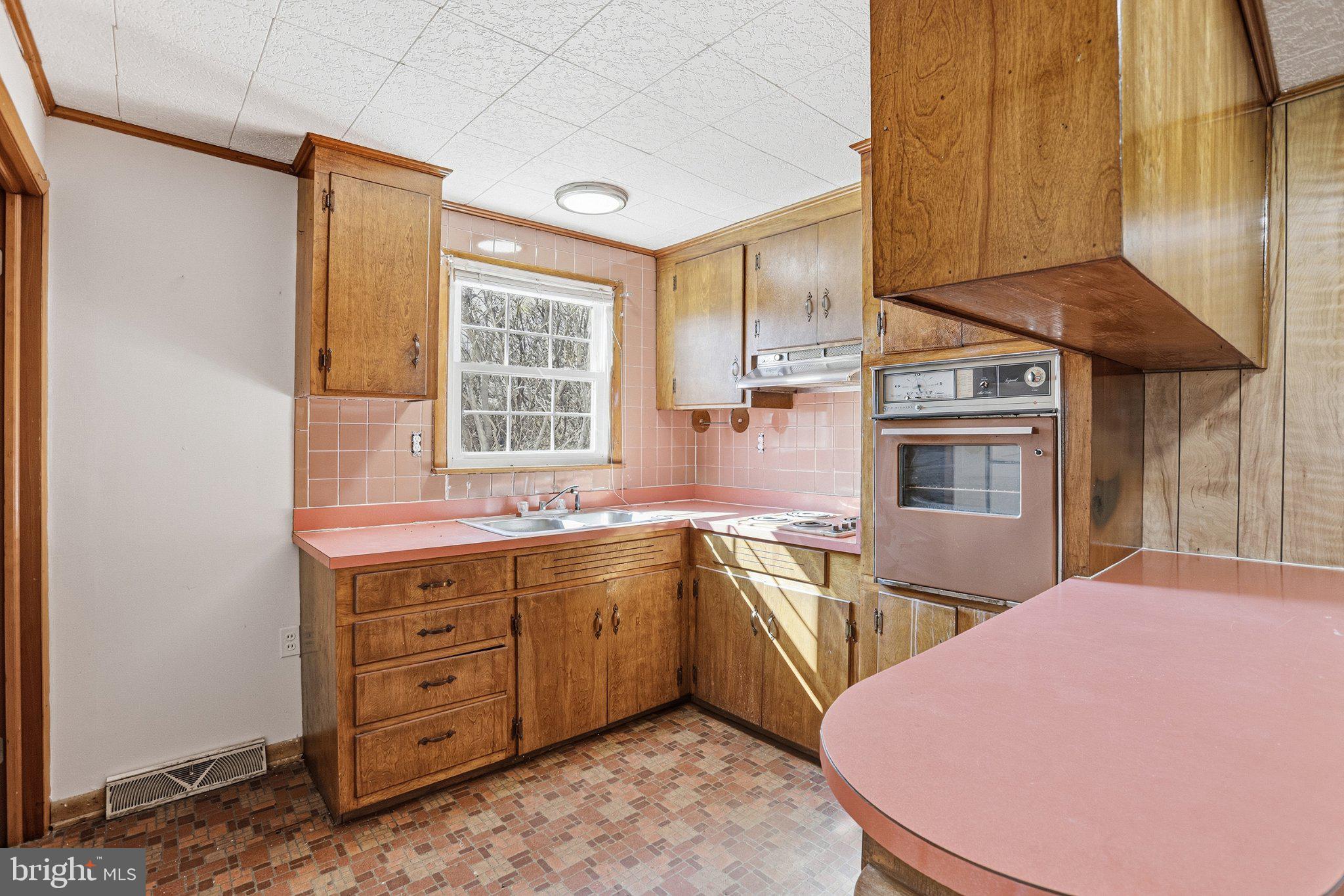 20287 Ridge Road Colonial Beach, VA 22443 - Photo 11 of 21 Charming retro kitchen with warm wood tones.