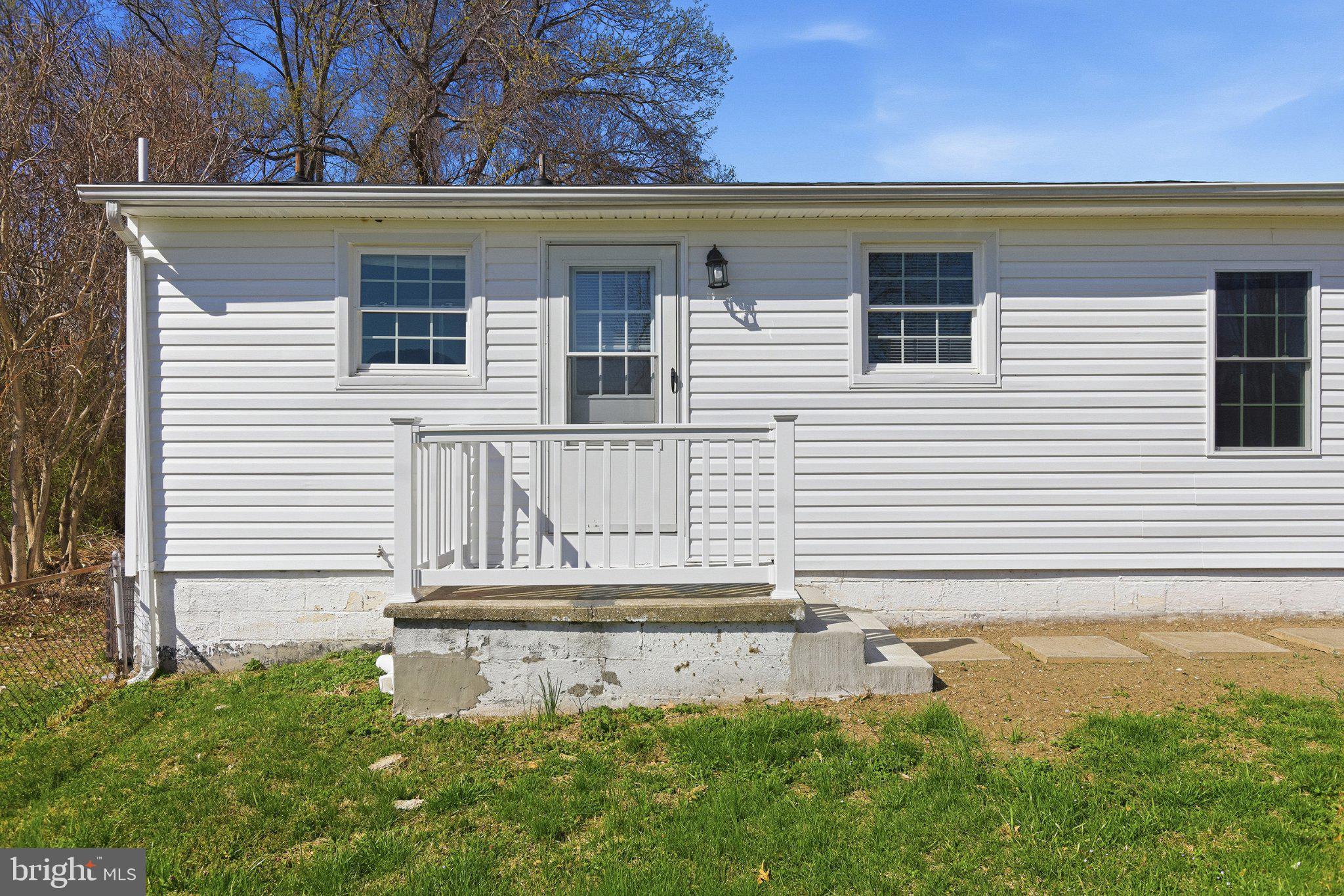 20287 Ridge Road Colonial Beach, VA 22443 - Photo 2 of 21 Charming white facade with welcoming steps.