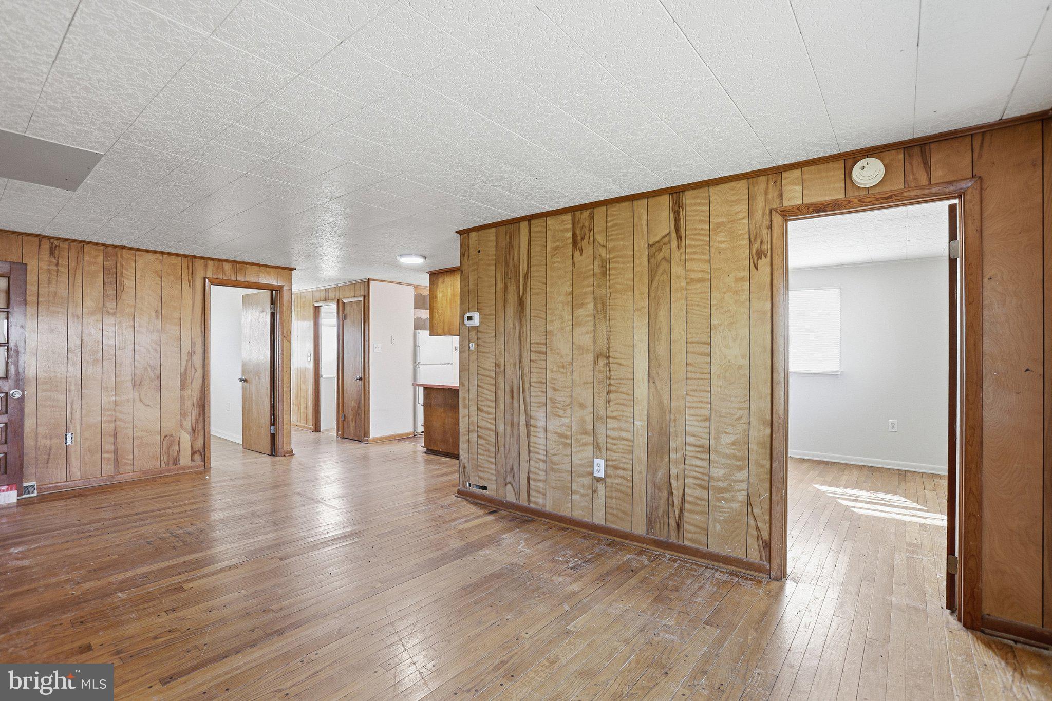 20287 Ridge Road Colonial Beach, VA 22443 - Photo 6 of 21 Spacious room with warm wood accents.