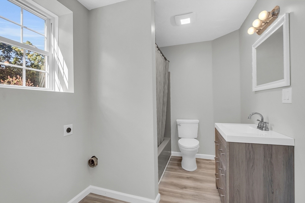 59 Molasses Hill Road Brookfield, MA 01506 - Photo 16 of 42 a bathroom with a sink a toilet and a window
