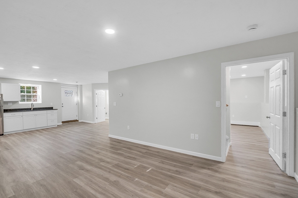 59 Molasses Hill Road Brookfield, MA 01506 - Photo 19 of 42 a view of an empty room and wooden floor