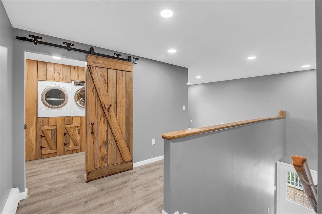 59 Molasses Hill Road Brookfield, MA 01506 - Photo 26 of 42 a view of a hallway with wooden floor
