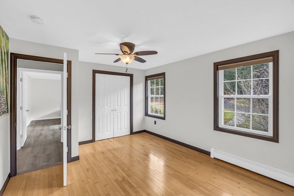 59 Molasses Hill Road Brookfield, MA 01506 - Photo 29 of 42 an empty room with windows and closet