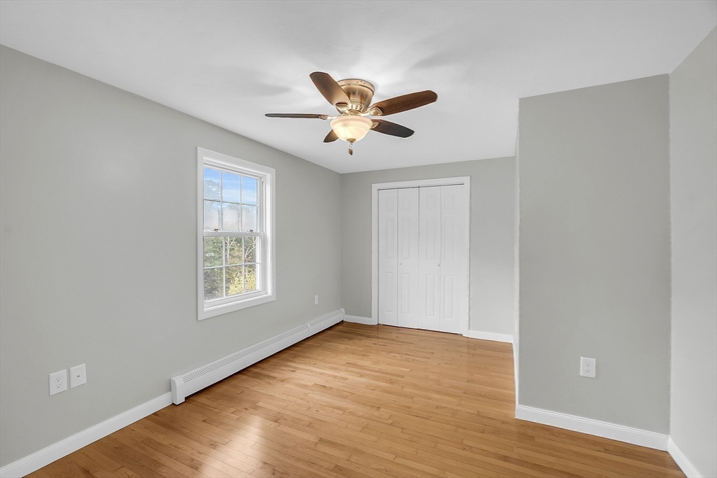 59 Molasses Hill Road Brookfield, MA 01506 - Photo 30 of 42 a view of an empty room with wooden floor and a window
