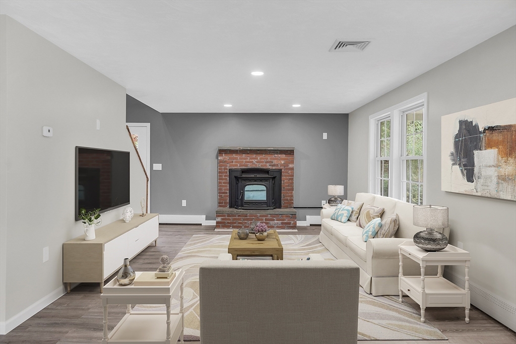 59 Molasses Hill Road Brookfield, MA 01506 - Photo 3 of 42 a living room with furniture and a flat screen tv