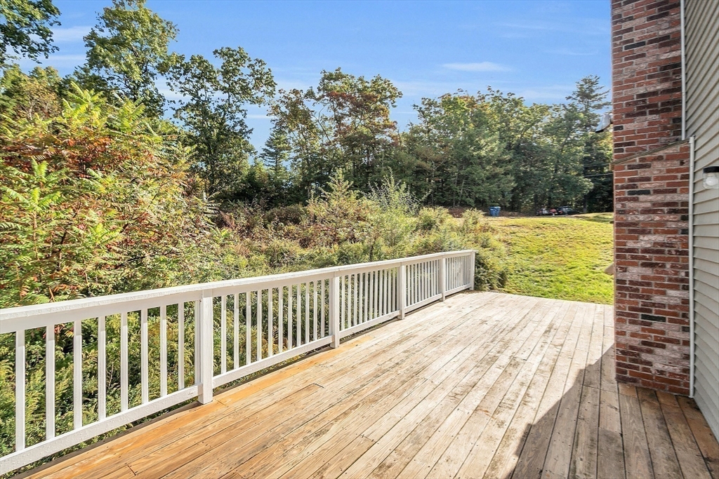 59 Molasses Hill Road Brookfield, MA 01506 - Photo 34 of 42 a view of a balcony with wooden floor and fence