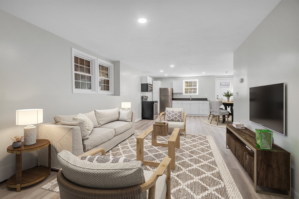 59 Molasses Hill Road Brookfield, MA 01506 - Photo 5 of 42 a living room with furniture and a flat screen tv