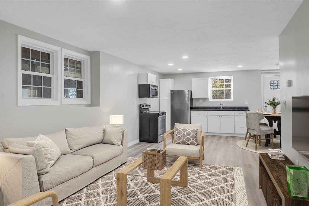 59 Molasses Hill Road Brookfield, MA 01506 - Photo 9 of 42 a living room with furniture and a view of kitchen