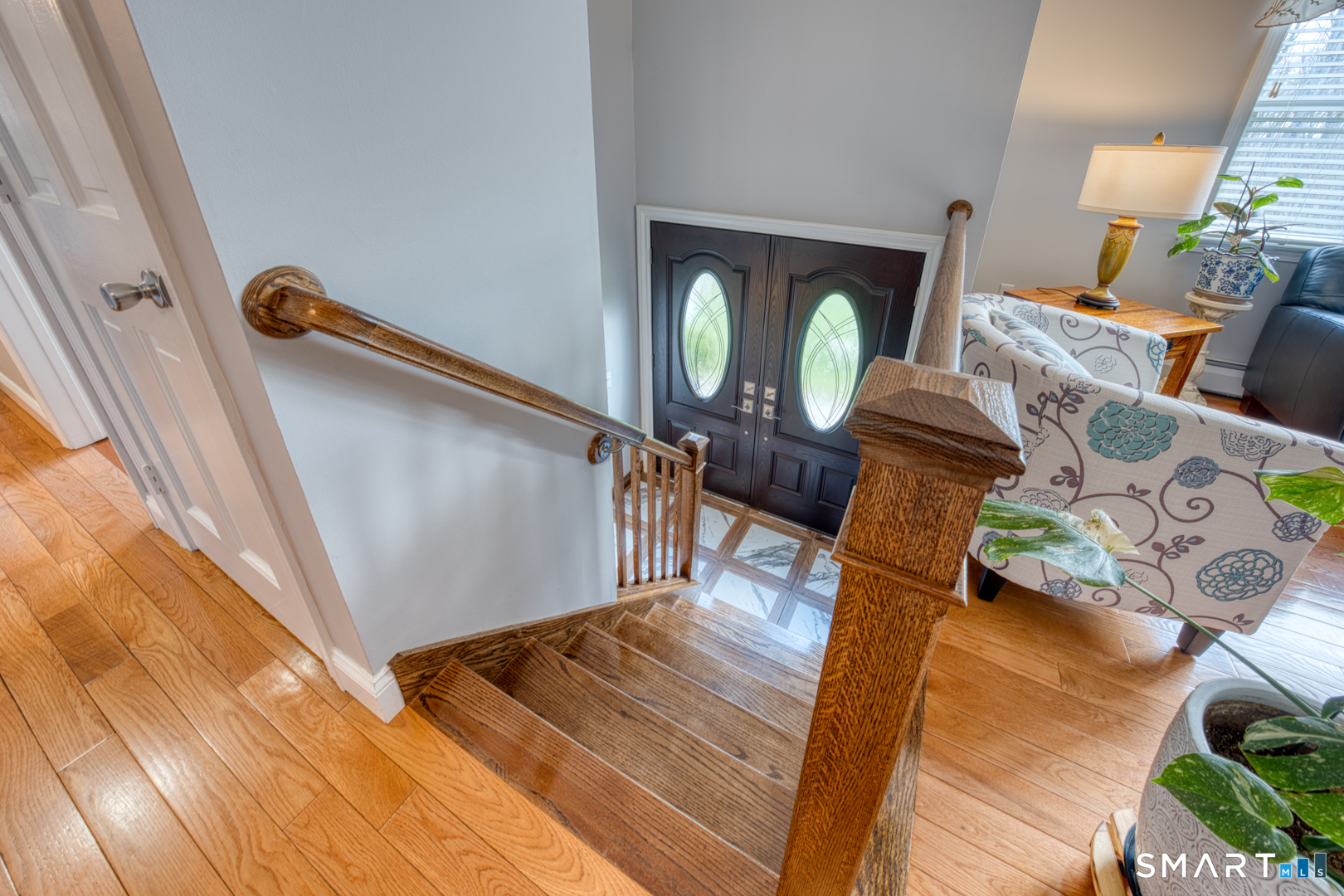 11 Hally Lane Colchester, CT 06415 - Photo 6 of 36 Brand new stairwell and custom railings lead to the lower level...check out the brand new front entrance (cost over $15,000)