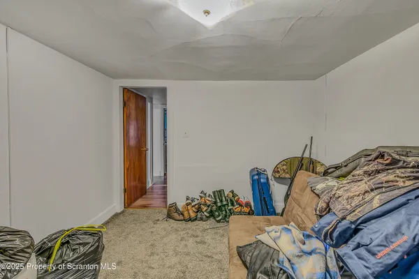 a bedroom with bed and closet