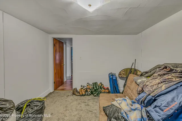 a bedroom with bed and closet