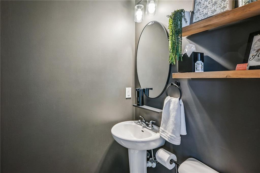 2358 Boulder Road Southeast Atlanta, GA 30316 - Photo 13 of 28 a bathroom with a sink mirror and toilet