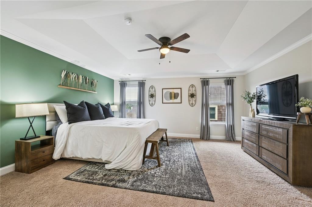 2358 Boulder Road Southeast Atlanta, GA 30316 - Photo 15 of 28 a bedroom with a large bed and a flat screen tv