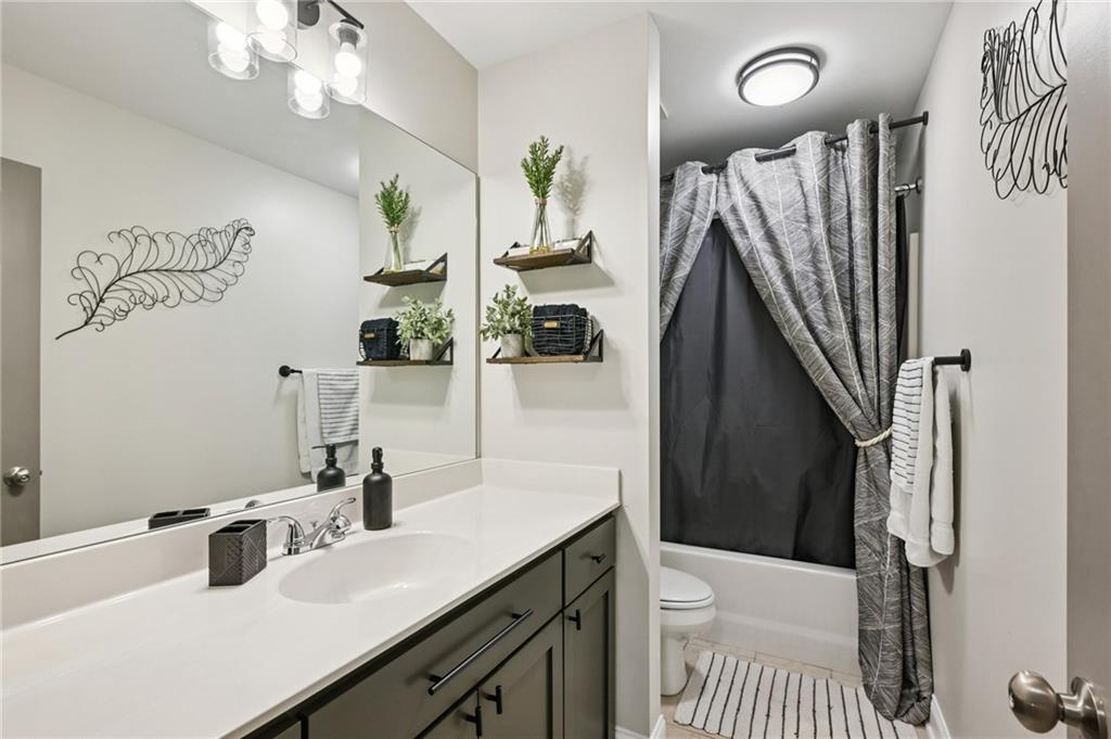 2358 Boulder Road Southeast Atlanta, GA 30316 - Photo 20 of 28 a bathroom with a sink a toilet and shower