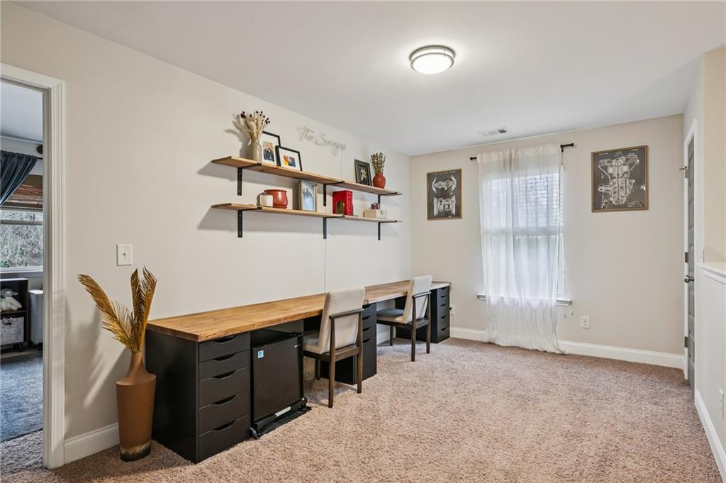 2358 Boulder Road Southeast Atlanta, GA 30316 - Photo 22 of 28 a living room with furniture and a dining table