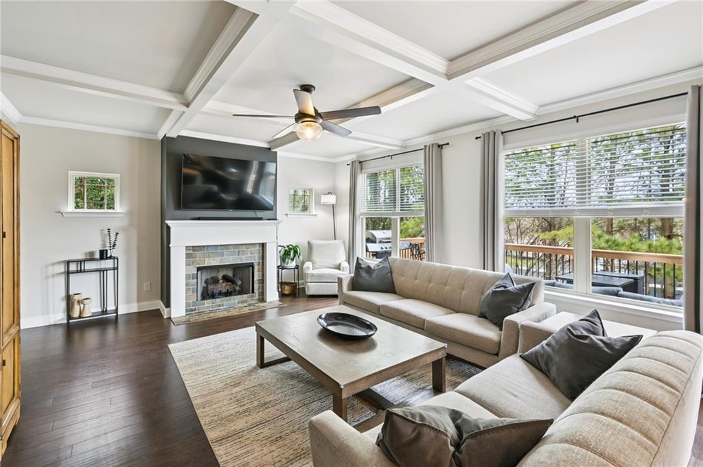 2358 Boulder Road Southeast Atlanta, GA 30316 - Photo 6 of 28 a living room with furniture a fireplace a flat screen tv and a large window