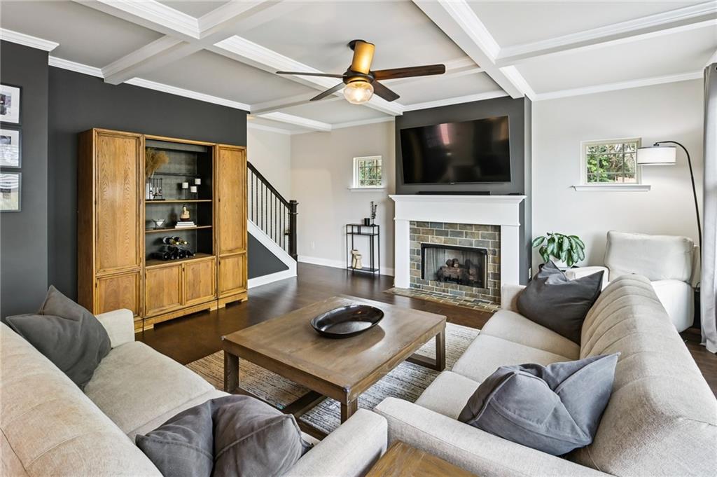 2358 Boulder Road Southeast Atlanta, GA 30316 - Photo 7 of 28 a living room with furniture a flat screen tv and a fireplace