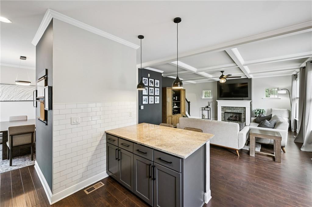 2358 Boulder Road Southeast Atlanta, GA 30316 - Photo 10 of 28 a kitchen with a sink a counter and chairs